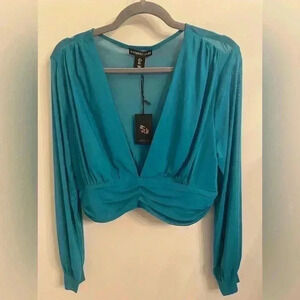 Sincerely Jules Top. Size L. Teal colored. New with tags.